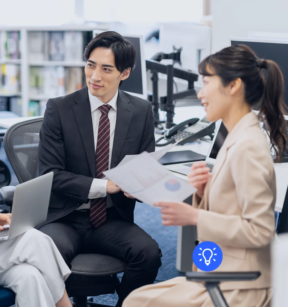 WeLink team collaborating on Japan market entry strategy in an office setting.