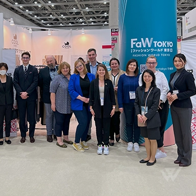 WeLink team at Fashion World Tokyo event, showcasing their expertise in Japan market entry services.